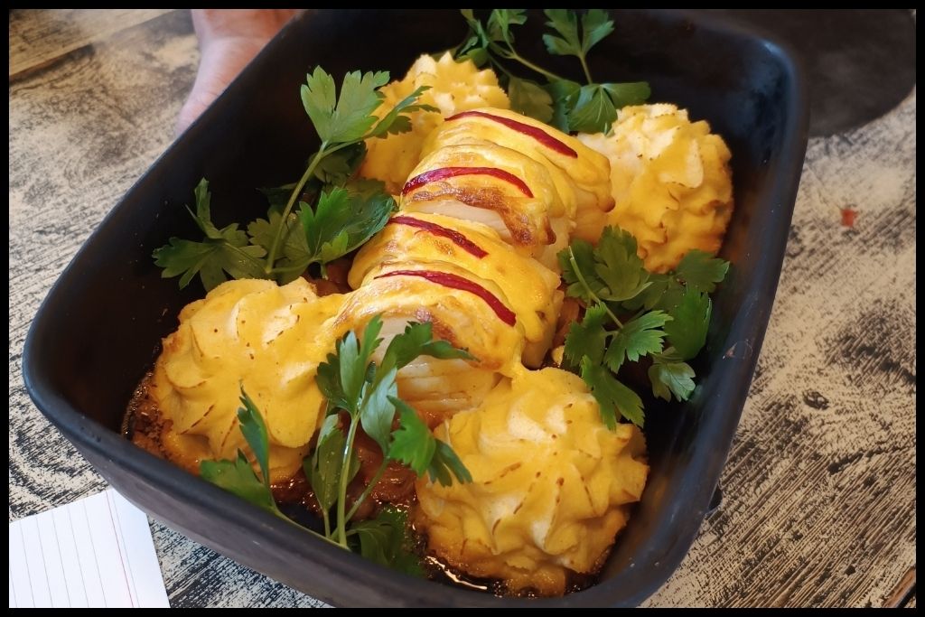 Where to Eat Bacalhau in Porto: Main entree the Bacalhau à Zé do Pipo, roasted cod with an over backed potato puree 